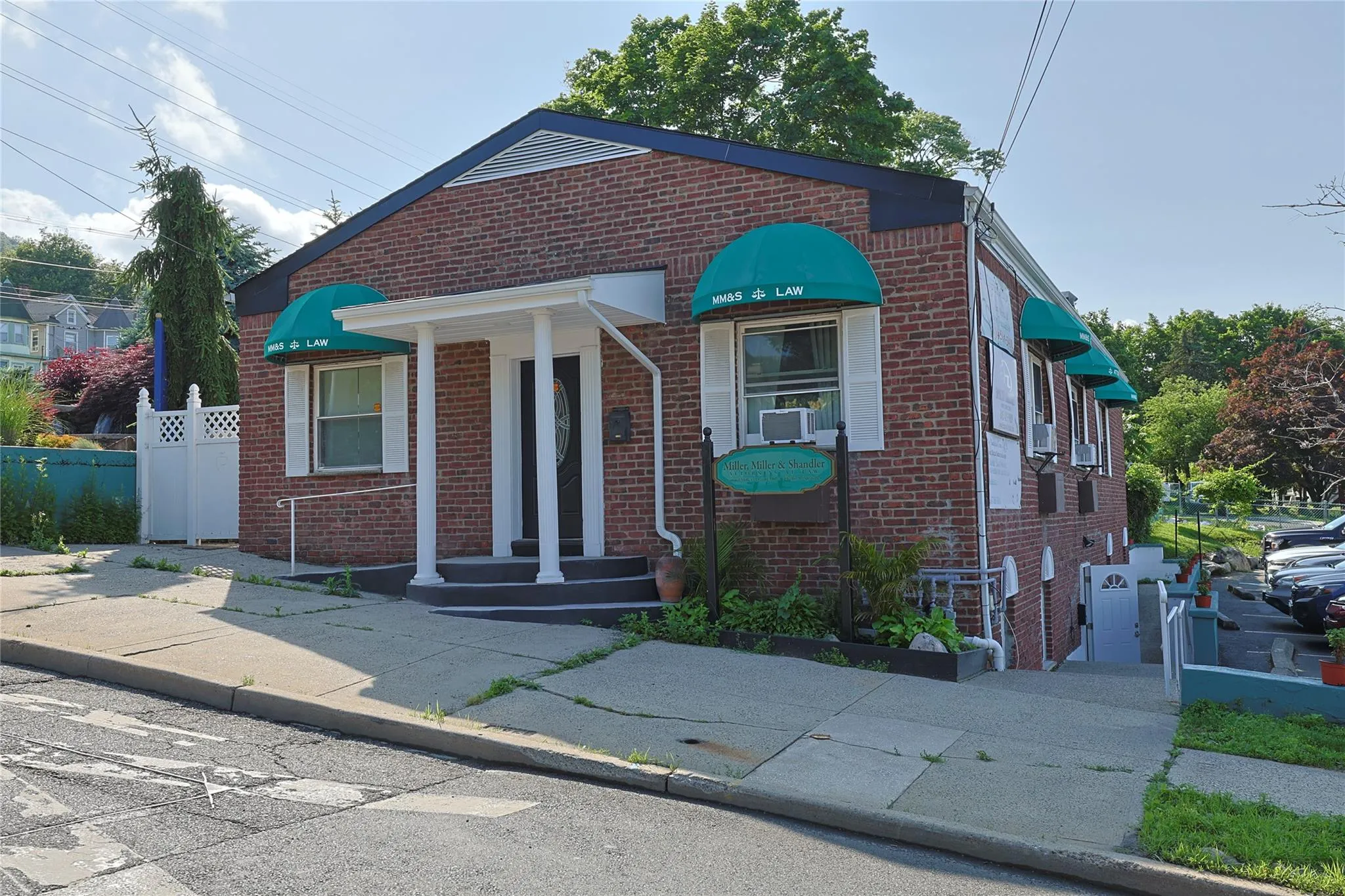 Bungalow featuring brick siding and cooling unit Bungalow featuring brick siding and cooling unit