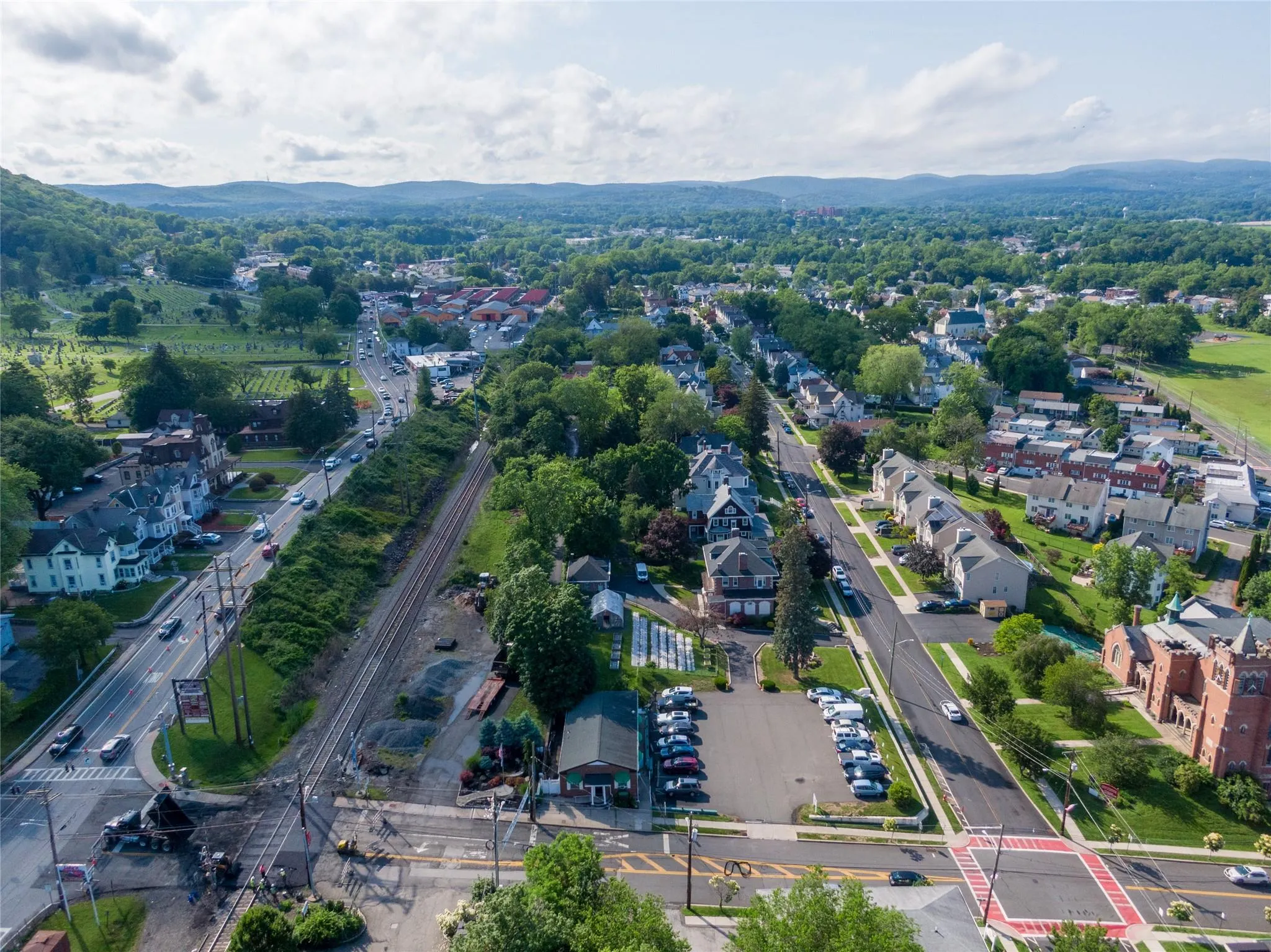 Aerial view of property and surrounding area with mountains Aerial view of property and surrounding area with mountains