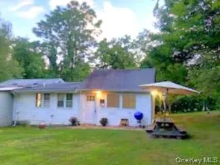 Ranch-style house with a front yard Ranch-style house with a front yard