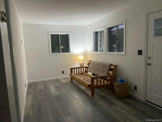 Living area featuring wood finished floors Living area featuring wood finished floors