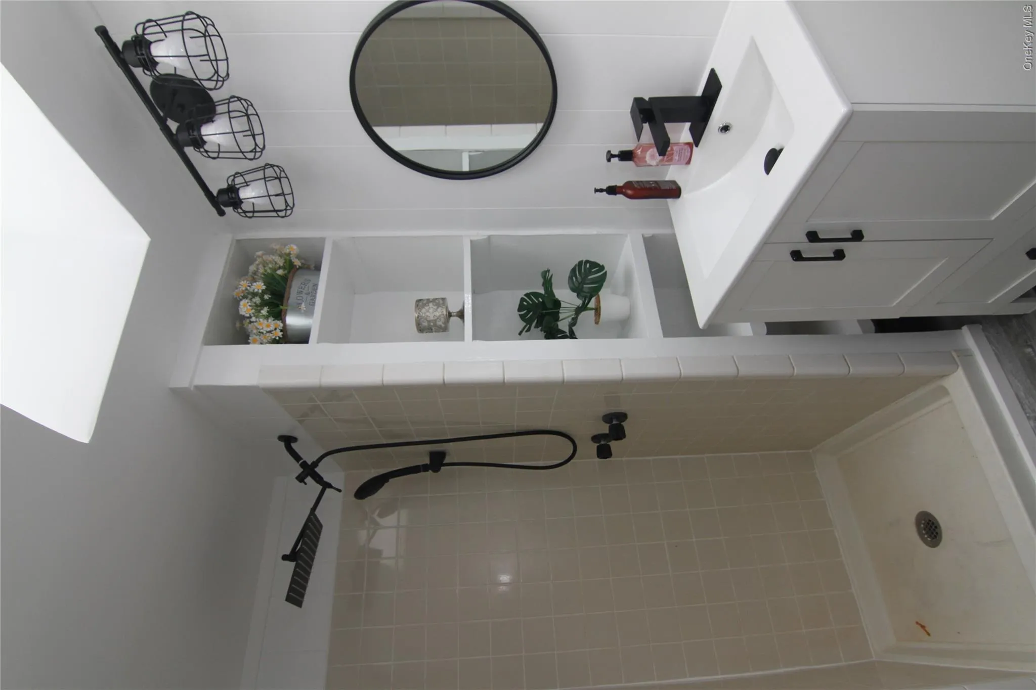 Bathroom with a stall shower and vanity Bathroom with a stall shower and vanity