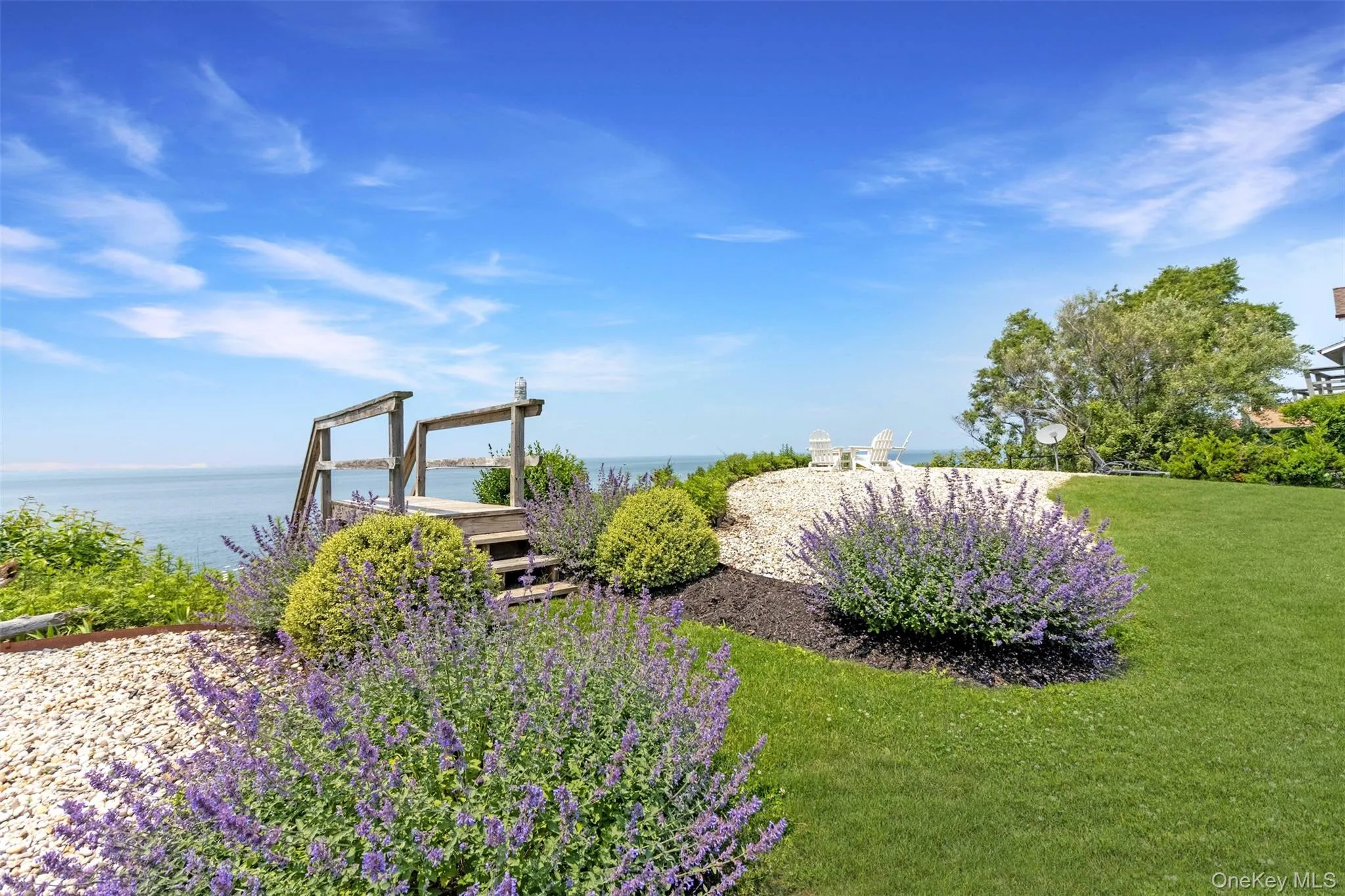 View of grassy yard with a water view View of grassy yard with a water view