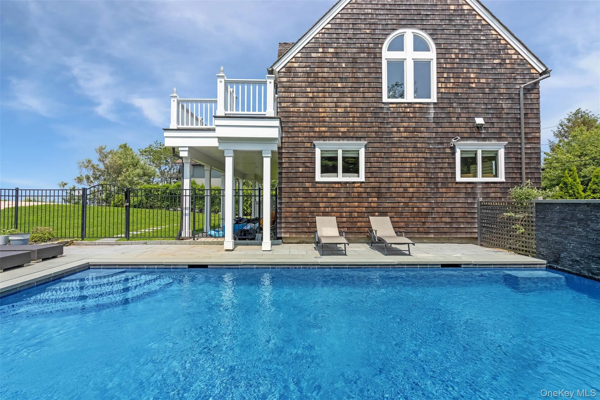 View of swimming pool featuring a patio area View of swimming pool featuring a patio area
