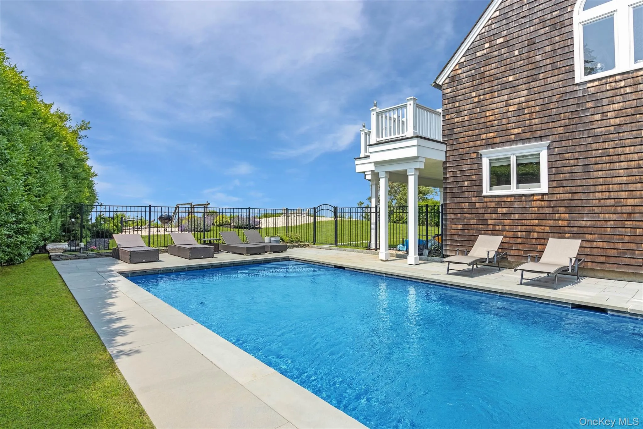View of pool with a patio View of pool with a patio