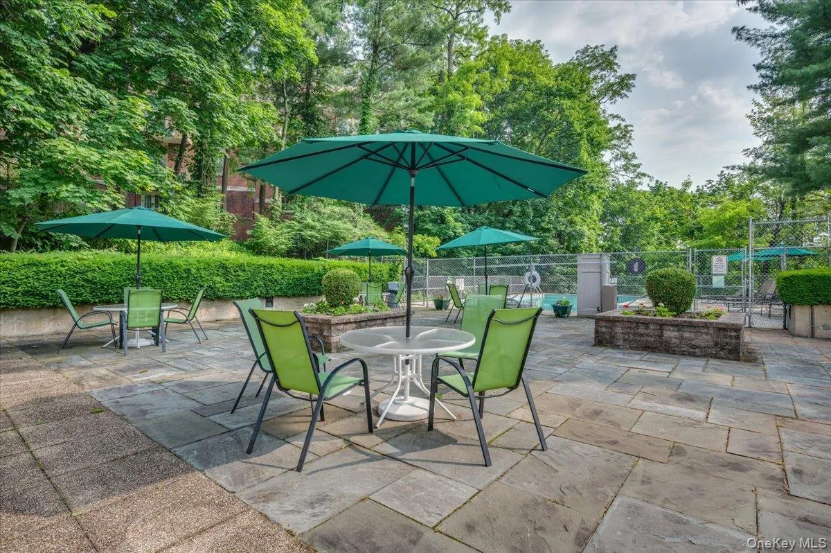 View of patio featuring outdoor dining area View of patio featuring outdoor dining area