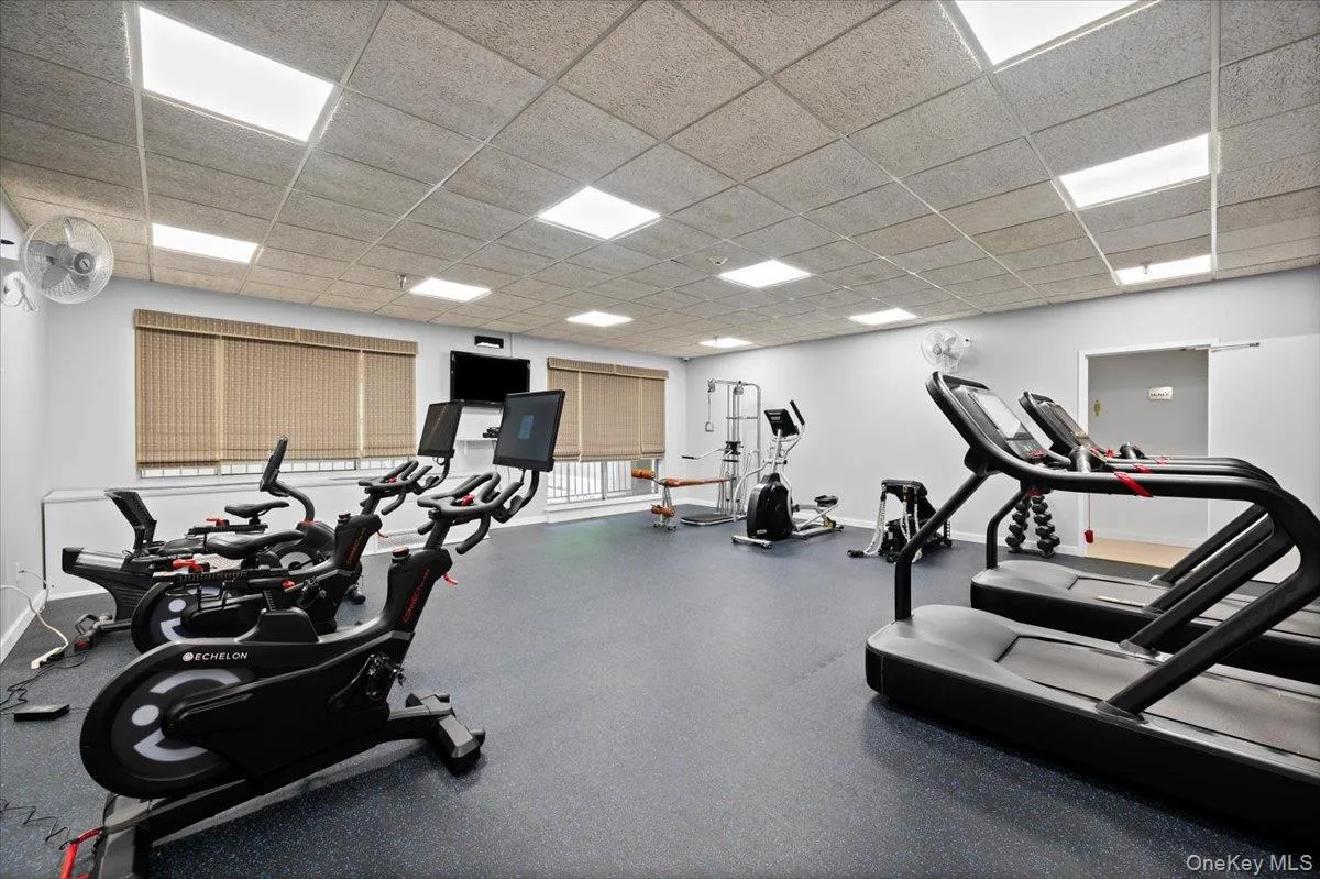 Exercise room featuring a paneled ceiling Exercise room featuring a paneled ceiling
