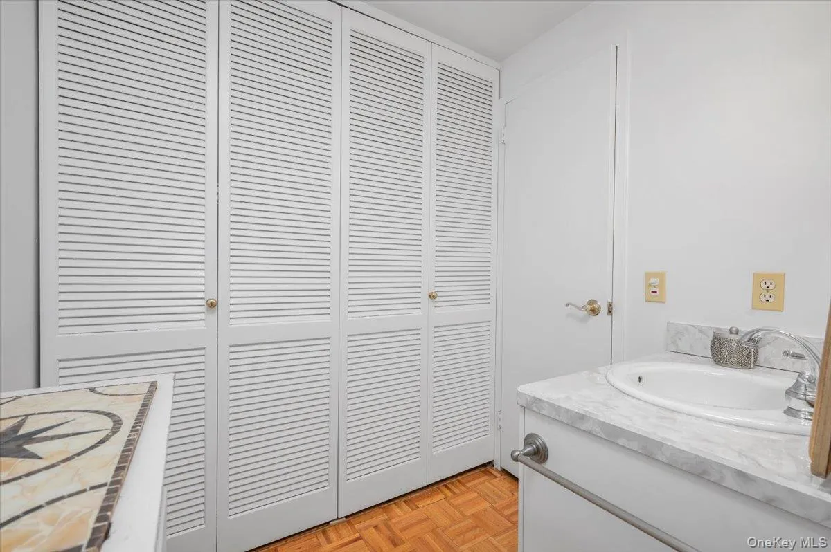 Bathroom with vanity and a double closet Bathroom with vanity and a double closet