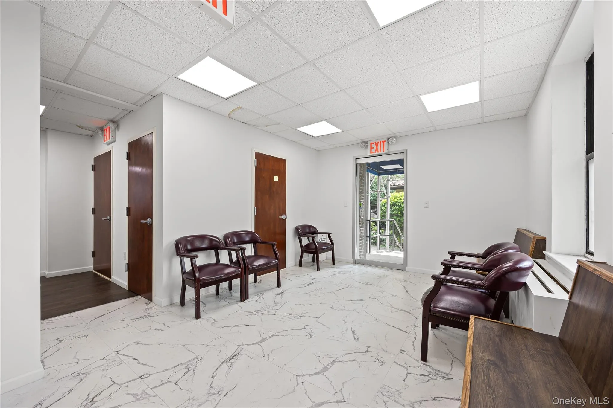 Waiting area featuring a drop ceiling Waiting area featuring a drop ceiling