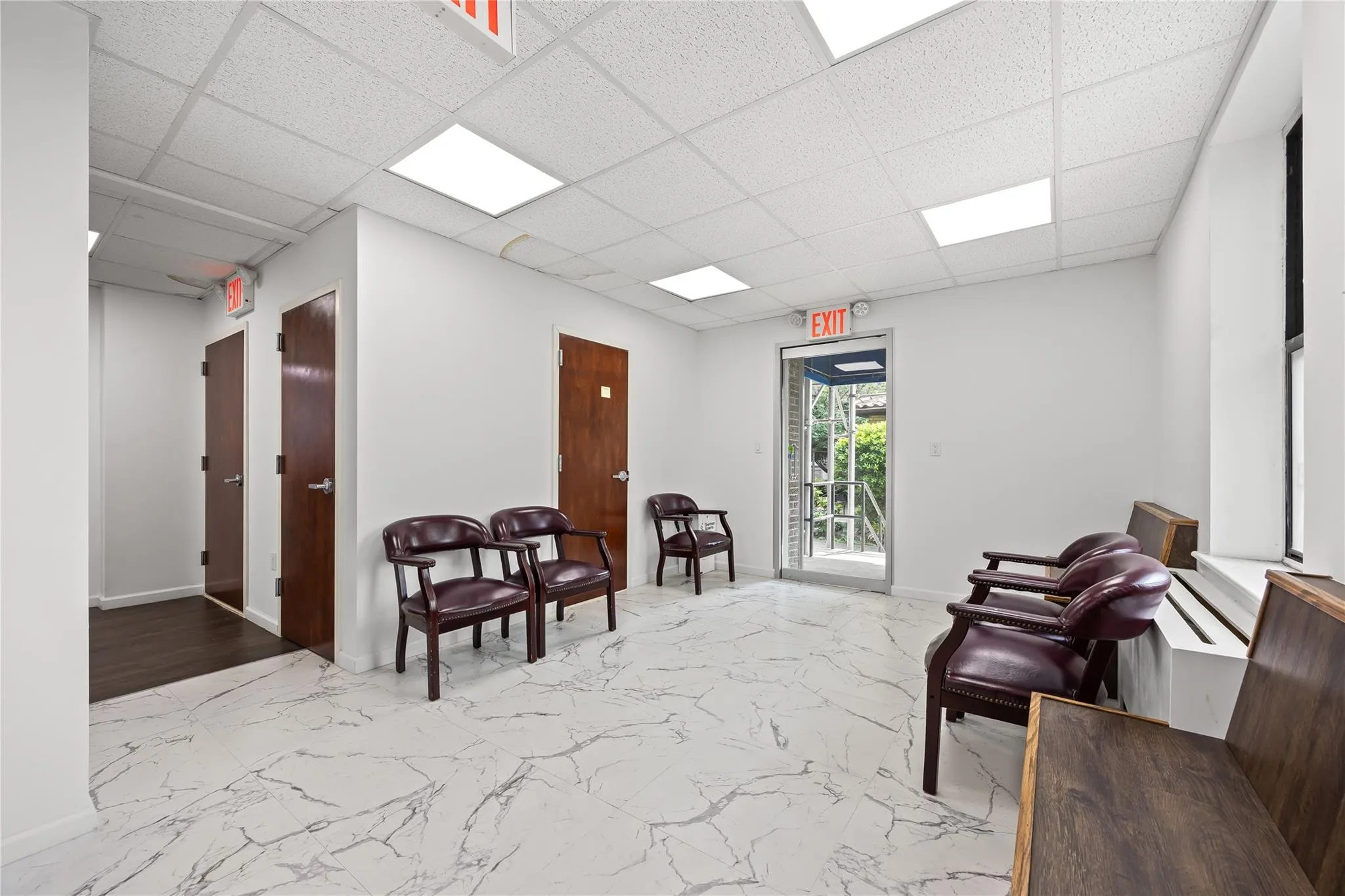 Lobby featuring a drop ceiling Lobby featuring a drop ceiling