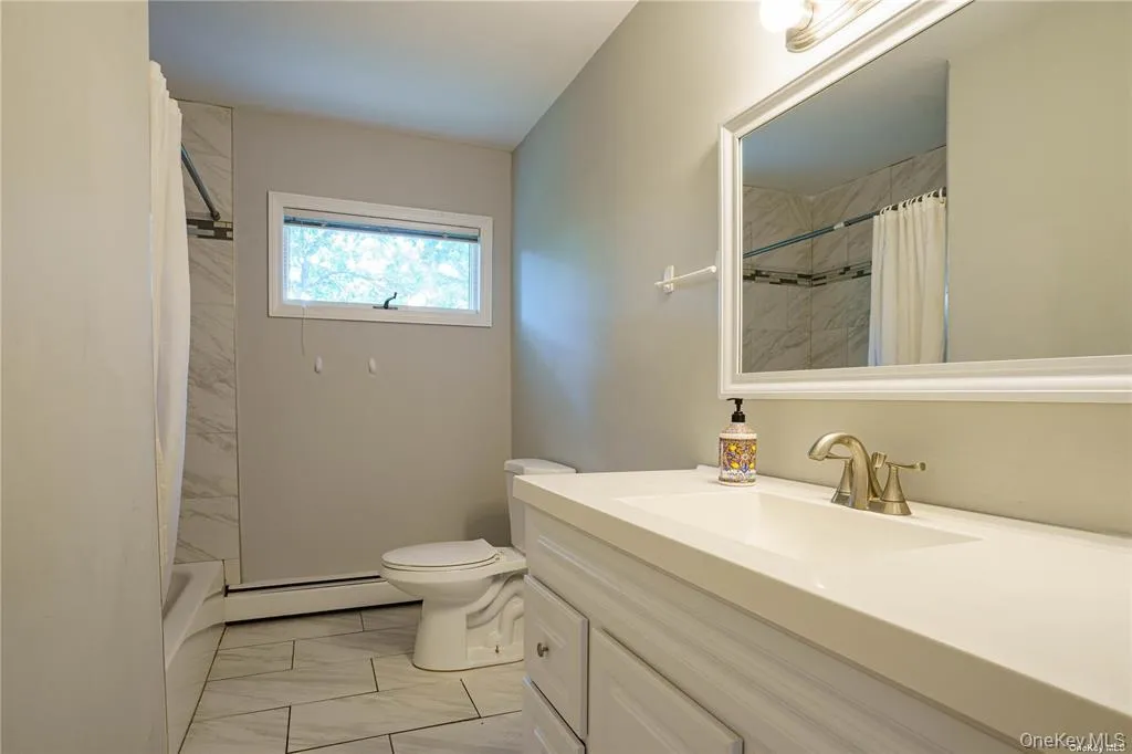 Main level first-floor hallway bathroom Main level first-floor hallway bathroom