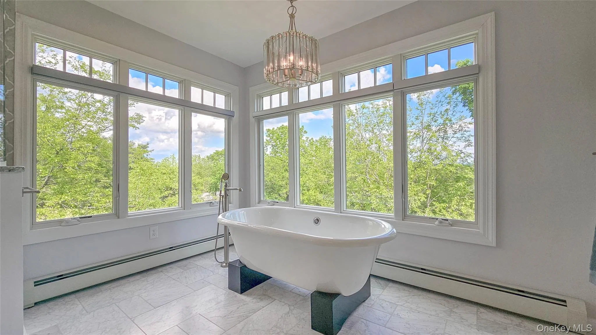 Fully renovated master bathroom -Hunter Douglas fully electric window shades on both picture windows. Gorgeous views of the property. Fully renovated master bathroom -Hunter Douglas fully electric window shades on both picture windows. Gorgeous views of the property.