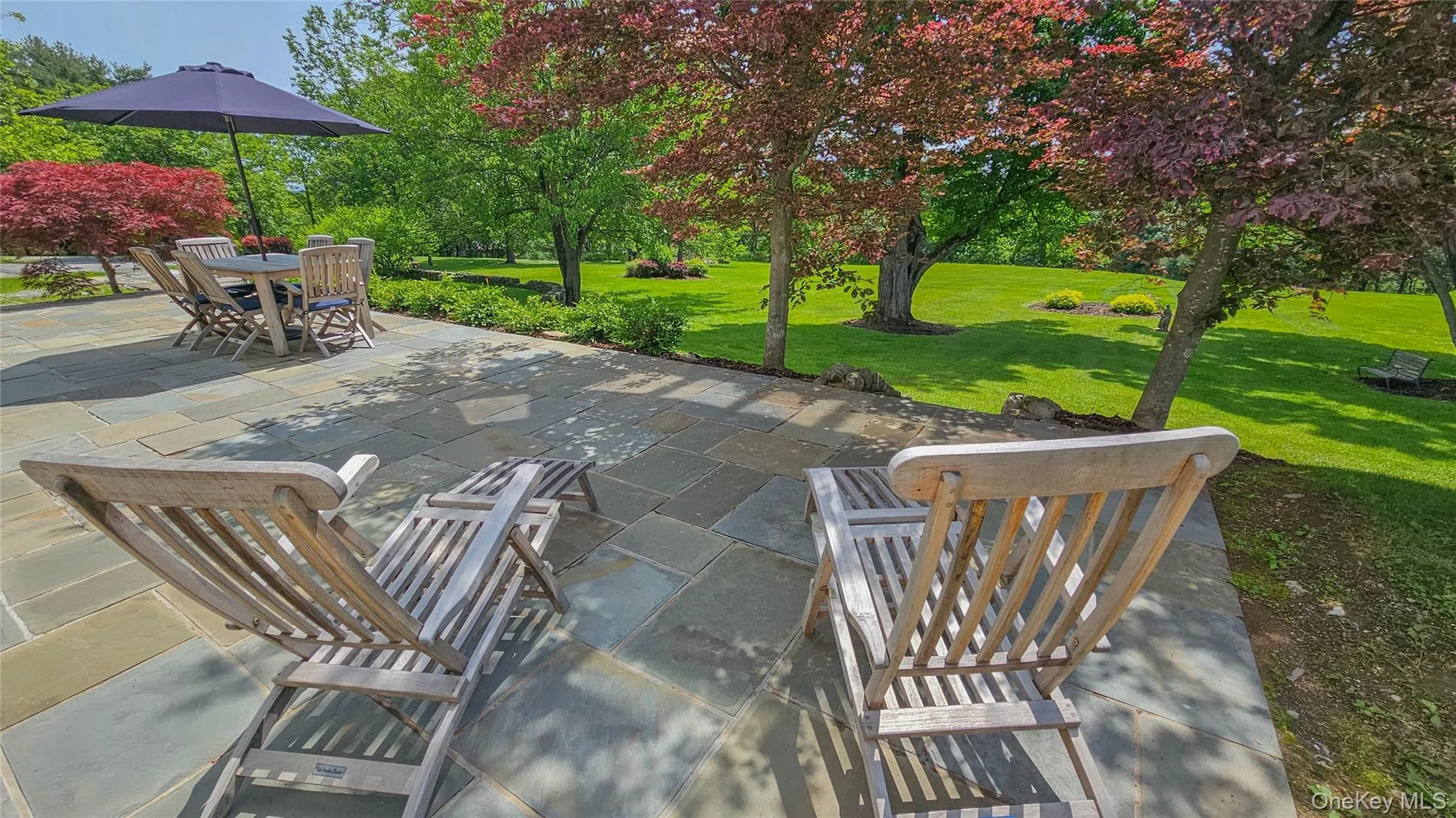 Relax and enjoy the privacy of the back yard from your new blue stone patio. New planting beds surrounding patio, new stairs leading off the patio Relax and enjoy the privacy of the back yard from your new blue stone patio. New planting beds surrounding patio, new stairs leading off the patio