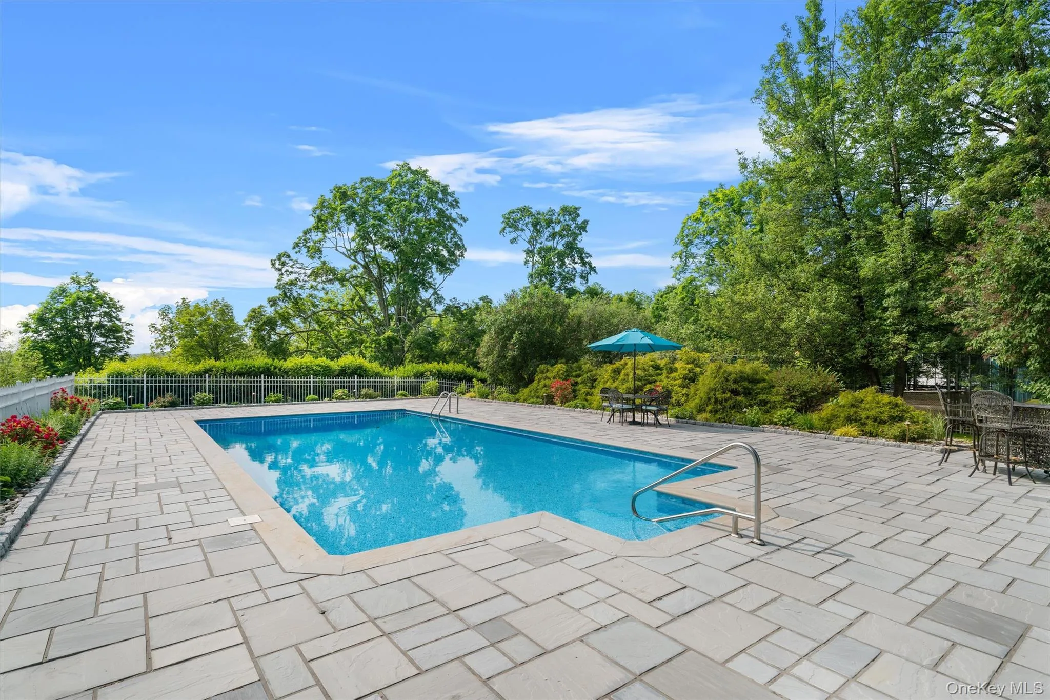Pool area has been recently renovated with imported stone from India that stays cool in the hot sun. New liner replacement, and freshly landscaped. Pool area has been recently renovated with imported stone from India that stays cool in the hot sun. New liner replacement, and freshly landscaped.