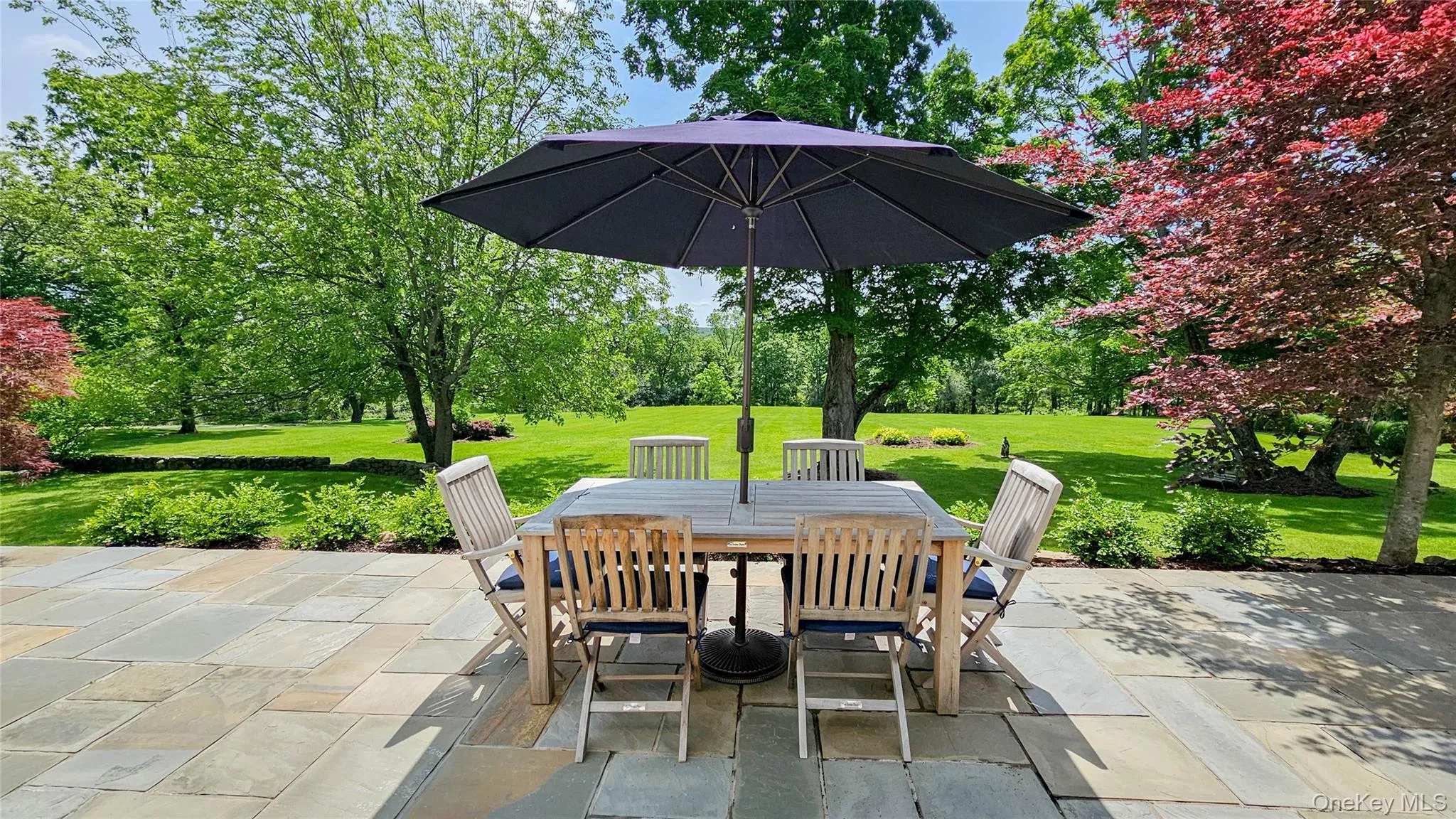 Relax and enjoy nature from your new blue stone patio. New planting beds surrounding patio, new stairs leading off the patio Relax and enjoy nature from your new blue stone patio. New planting beds surrounding patio, new stairs leading off the patio