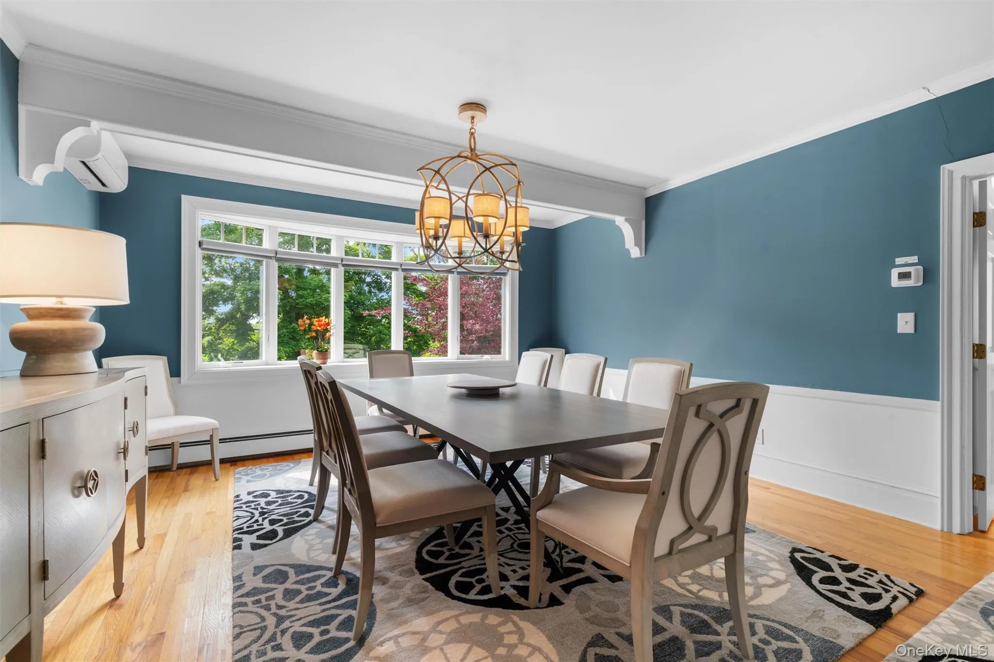 Formal dining room with stunning views of back yard. Refurbished walls, trim, interior doors and ceiling. New Anderson bow window, includes two side casement windows and three fixed inner segments, Hunter Douglas window shades. Formal dining room with stunning views of back yard. Refurbished walls, trim, interior doors and ceiling. New Anderson bow window, includes two side casement windows and three fixed inner segments, Hunter Douglas window shades.