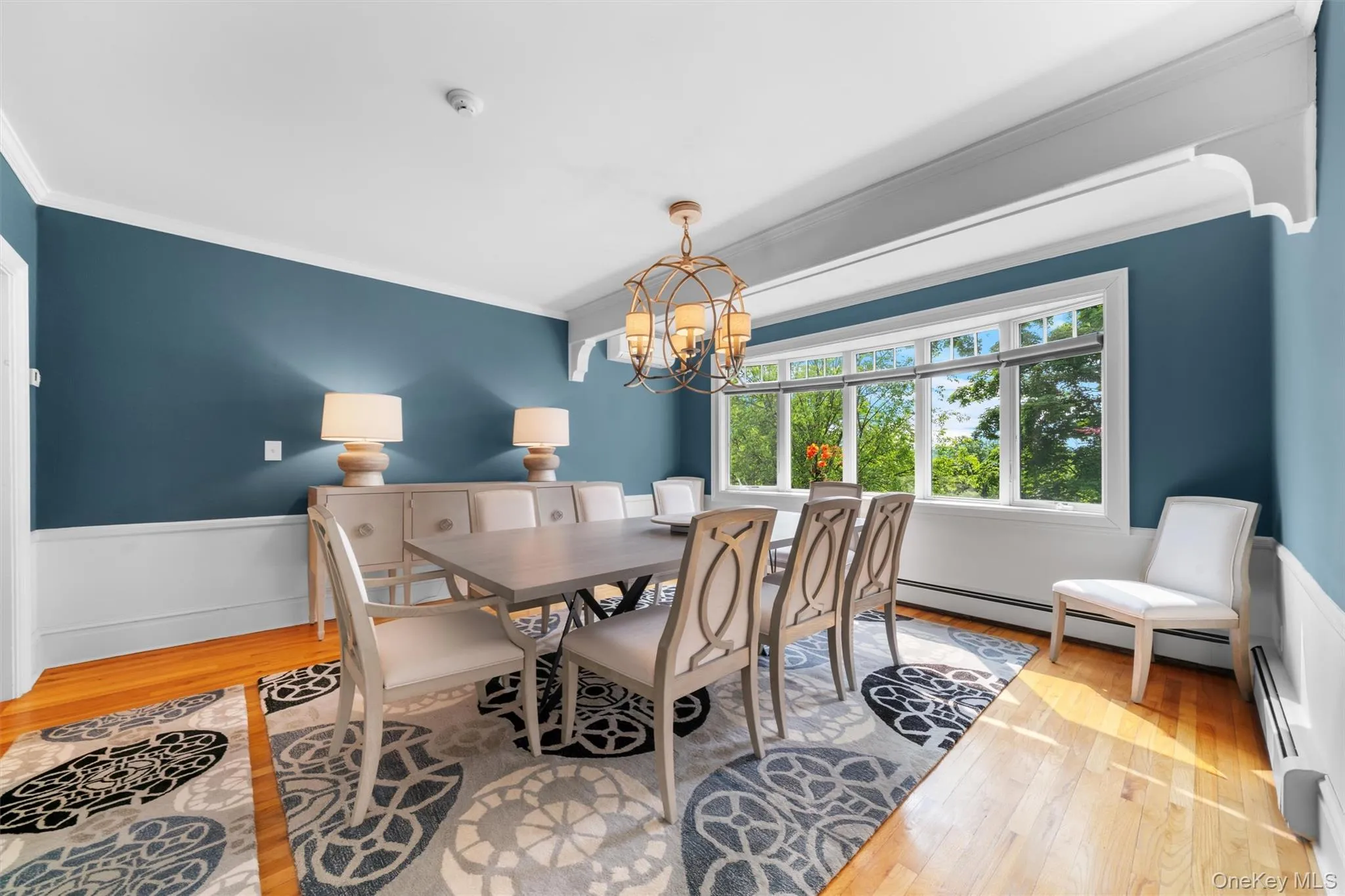 Formal dining room with stunning views of back yard. Formal dining room with stunning views of back yard.