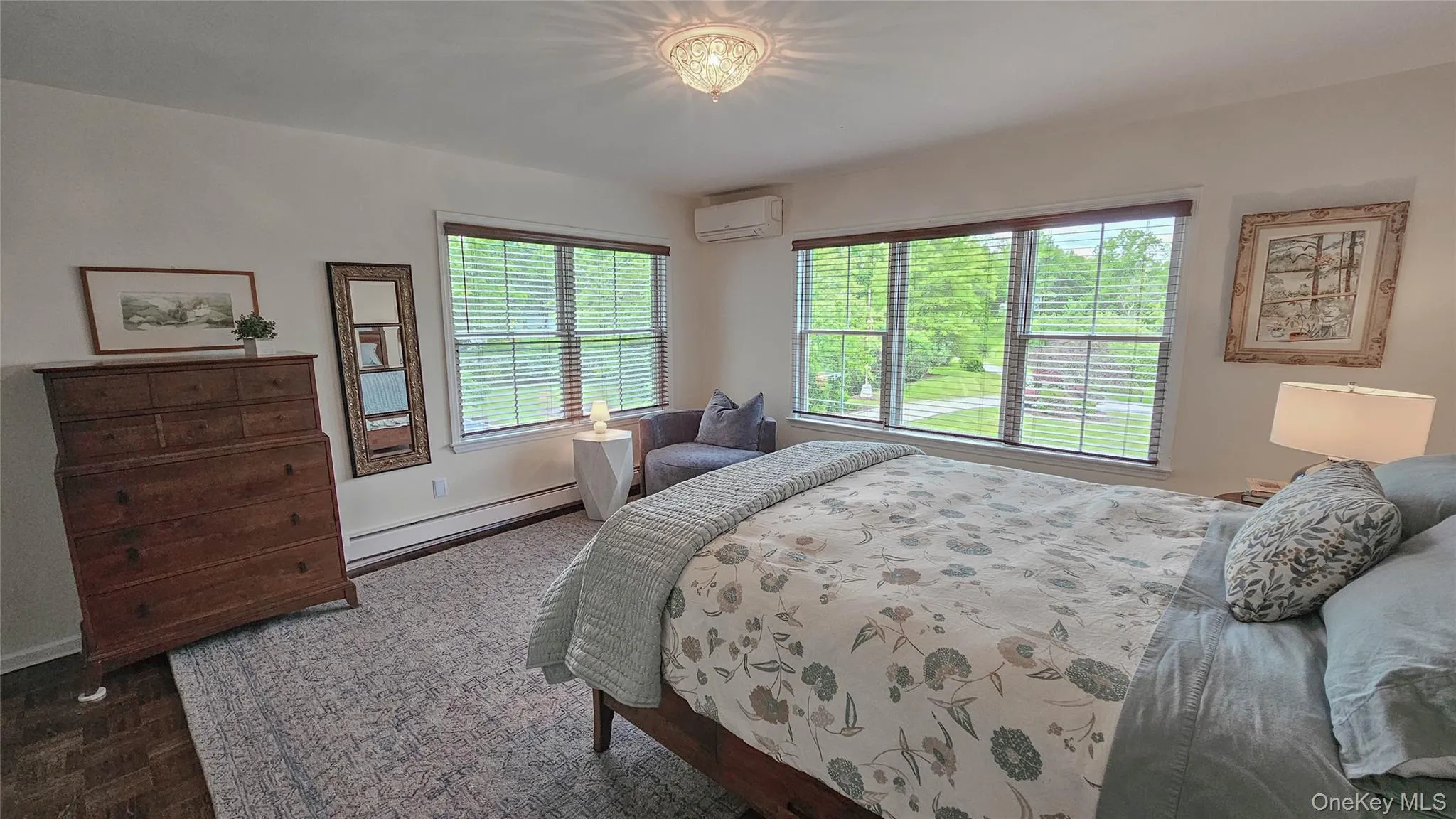 Bedroom with views of the front lawn. Refinished and stained hardwood floor, Anderson picture windows, Hunter Douglas window shades. Bedroom with views of the front lawn. Refinished and stained hardwood floor, Anderson picture windows, Hunter Douglas window shades.