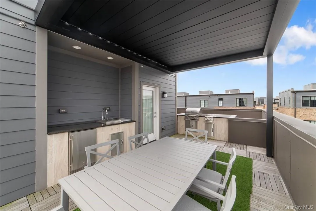 Deck comes with Furniture, Sink, Mini Frig, Propane Grill and Two-Burner Cooktop, Pergola has Remote Control Deck comes with Furniture, Sink, Mini Frig, Propane Grill and Two-Burner Cooktop, Pergola has Remote Control