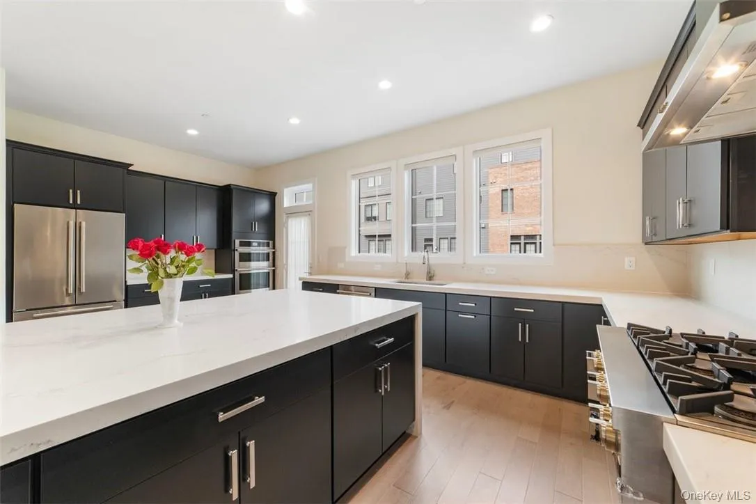 Close up view of kitchen and door to Trex balcony Close up view of kitchen and door to Trex balcony