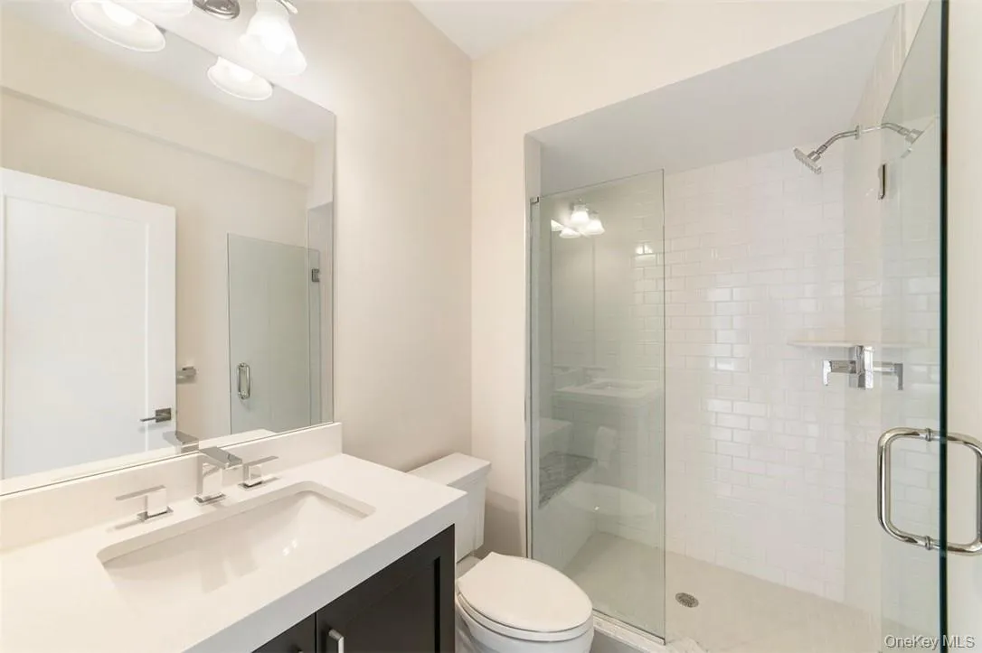 Vanity, Mirror and Step-In Shower in Ground Floor Bedroom Vanity, Mirror and Step-In Shower in Ground Floor Bedroom