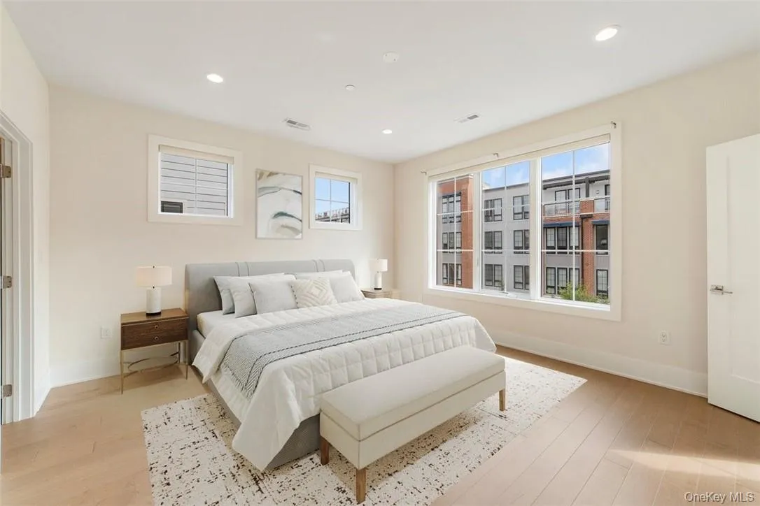 Luxurious Primary Bedroom, virtually staged. Door to walk-in closet on the left. Door to ensuite bathroom on the right. Luxurious Primary Bedroom, virtually staged. Door to walk-in closet on the left. Door to ensuite bathroom on the right.