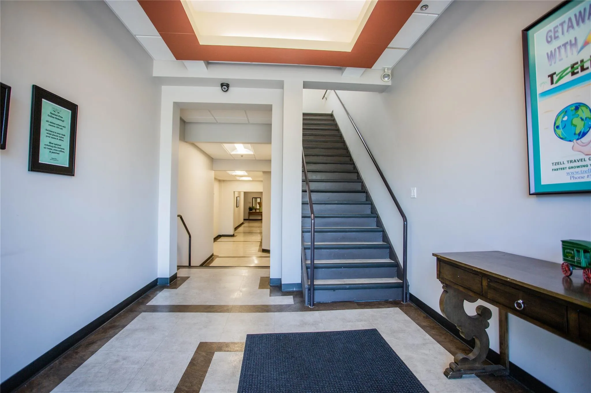 Stairway with inlaid floor details and tile patterned flooring Stairway with inlaid floor details and tile patterned flooring