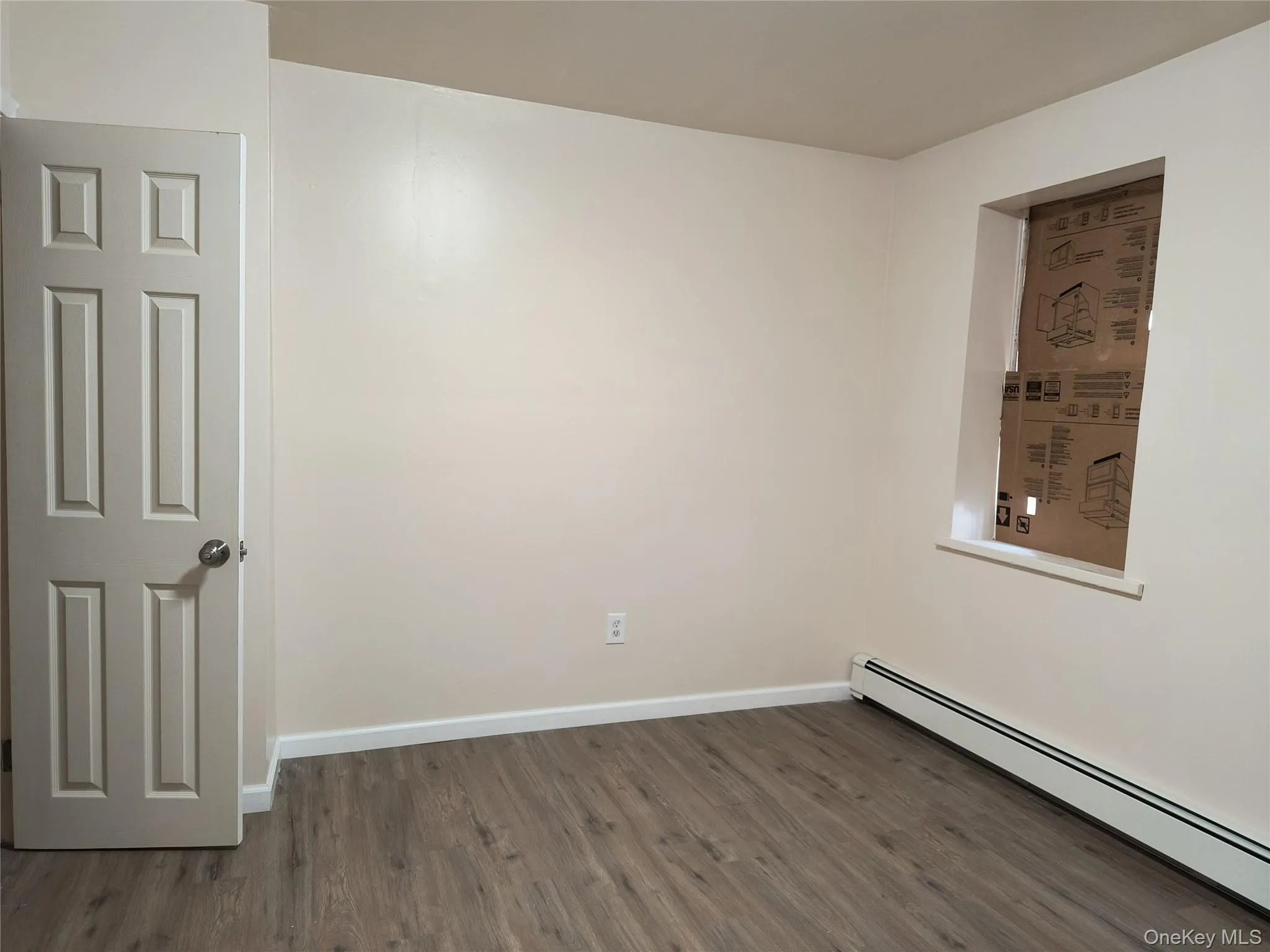 Bedroom with a baseboard heating Bedroom with a baseboard heating