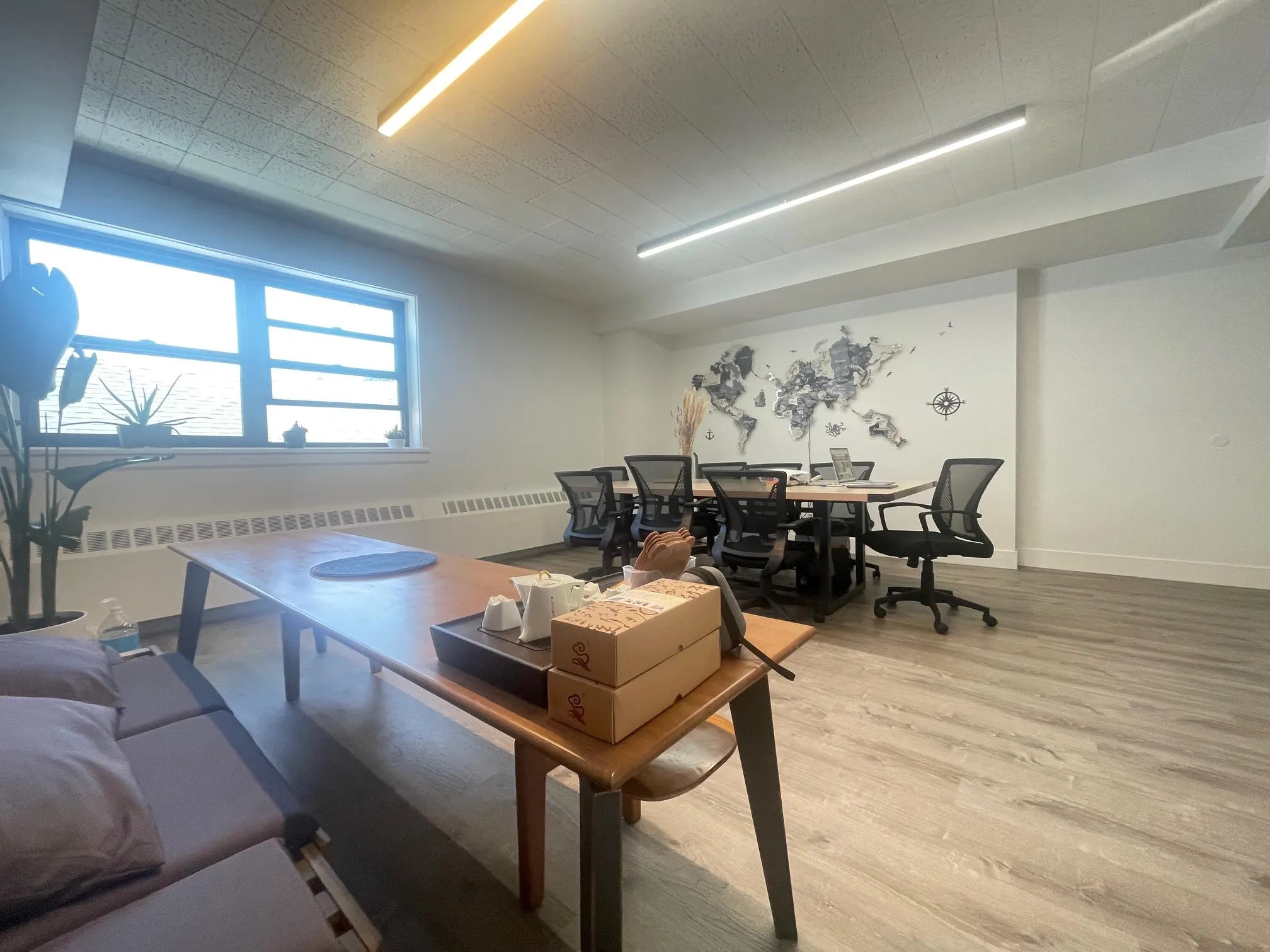 Living area featuring light wood finished floors and radiator Living area featuring light wood finished floors and radiator