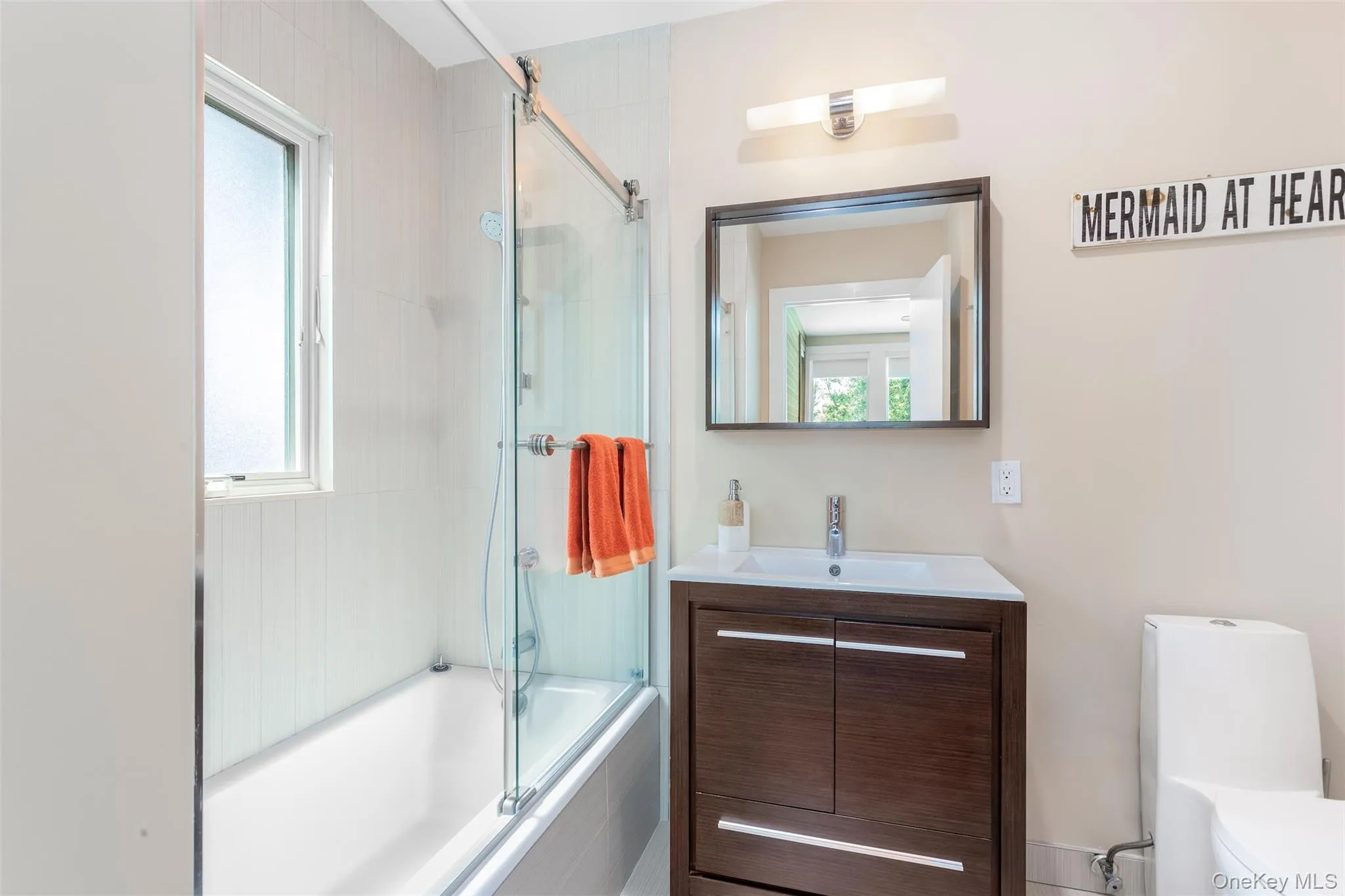 Bathroom with shower / bath combination with glass door and vanity Bathroom with shower / bath combination with glass door and vanity