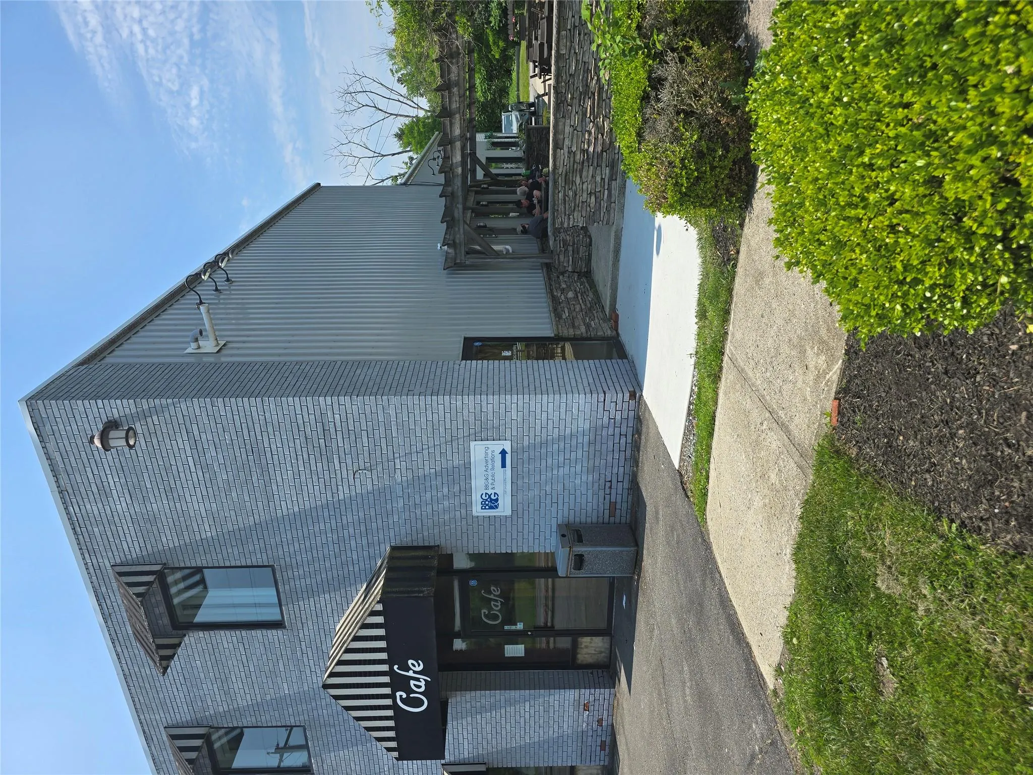 View of building exterior. Entrance to the right side of the cafe. View of building exterior. Entrance to the right side of the cafe.