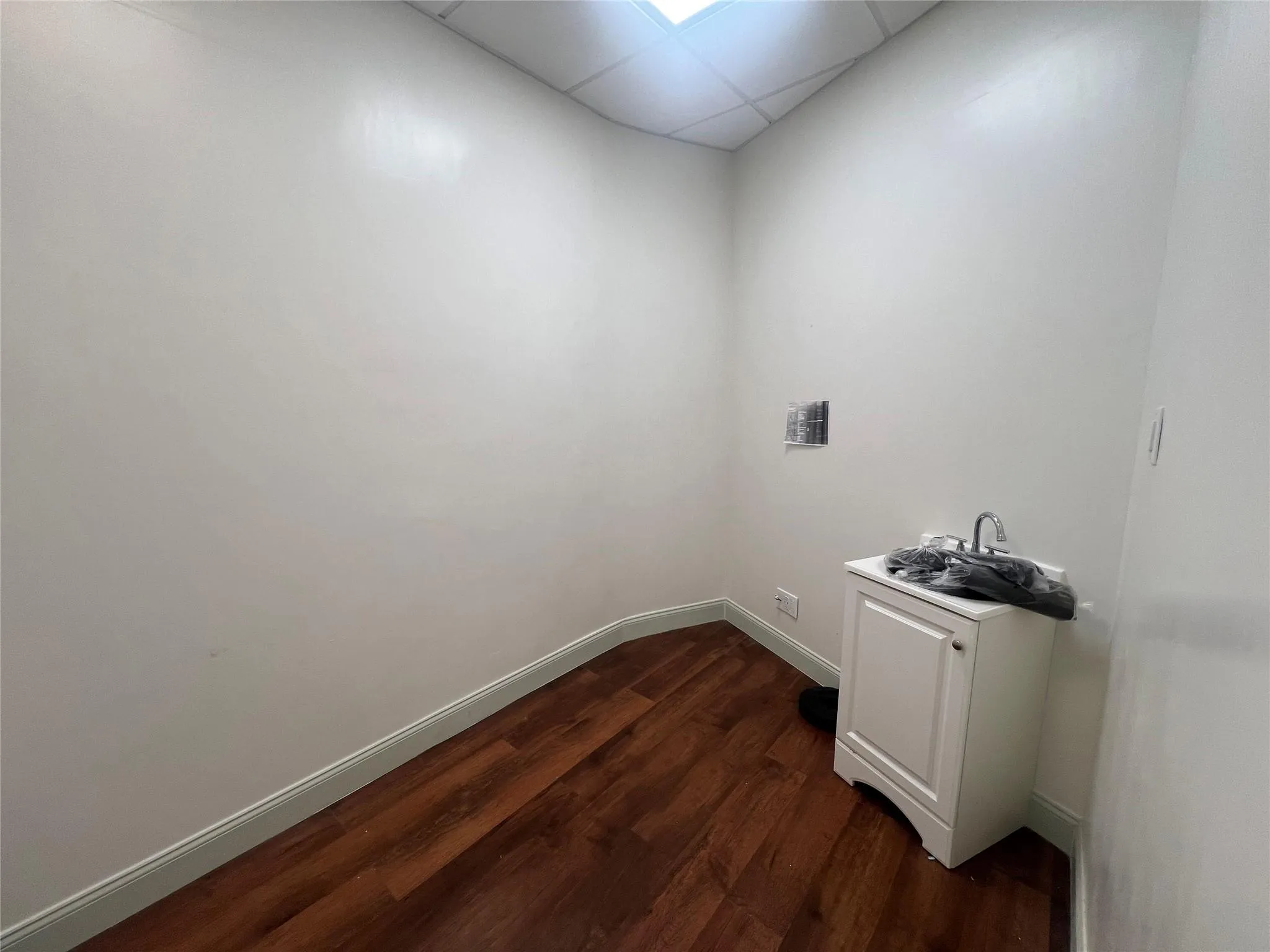 Washroom featuring dark wood finished floors and baseboards Washroom featuring dark wood finished floors and baseboards