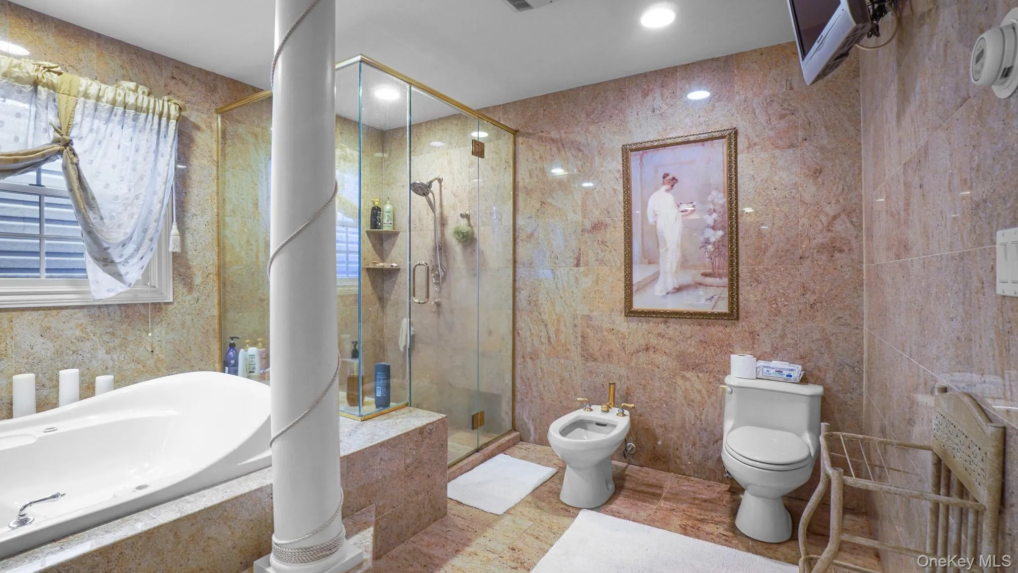 Full bath featuring tile walls, a shower stall, a bidet, and recessed lighting Full bath featuring tile walls, a shower stall, a bidet, and recessed lighting