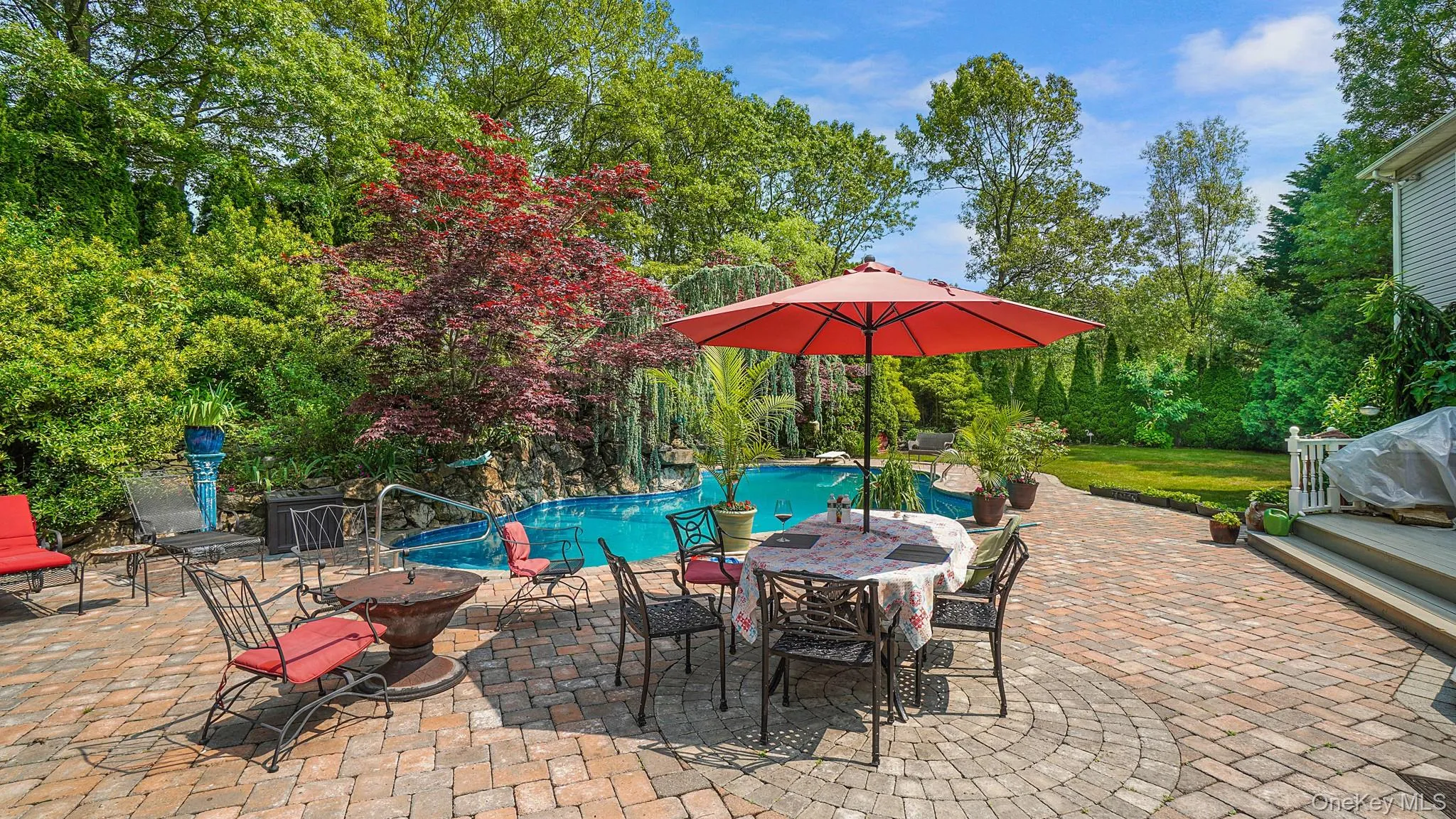 View of patio / terrace featuring an outdoor pool View of patio / terrace featuring an outdoor pool