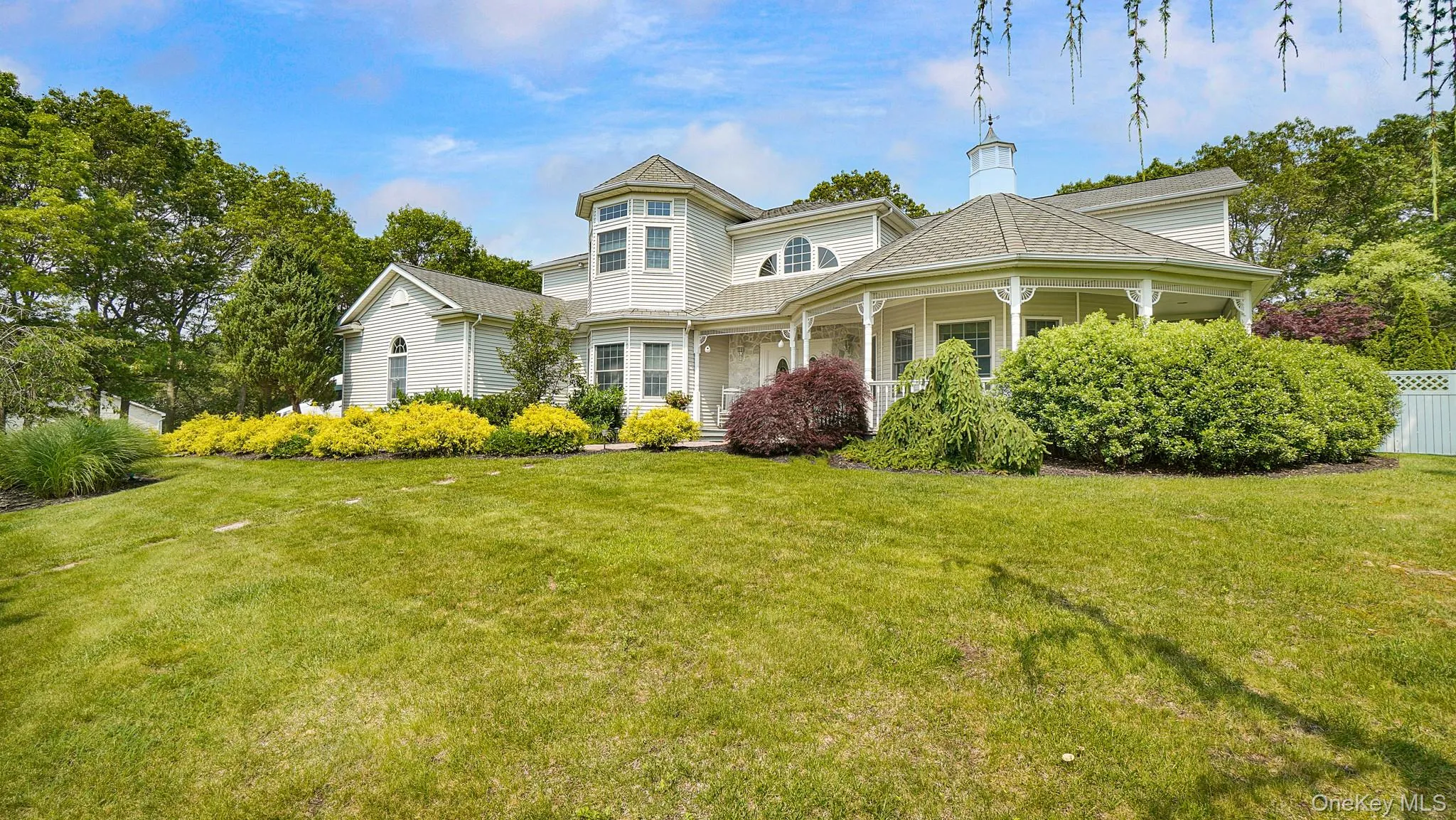 Victorian-style house featuring covered porch and a chimney Victorian-style house featuring covered porch and a chimney