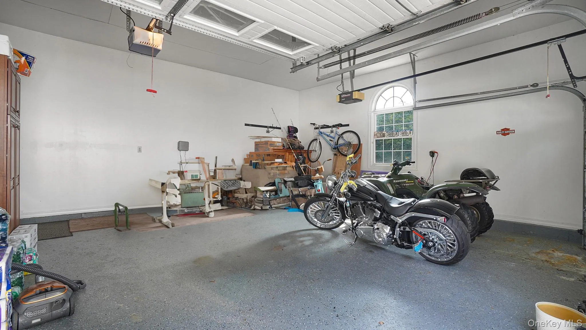 Garage featuring a garage door opener Garage featuring a garage door opener