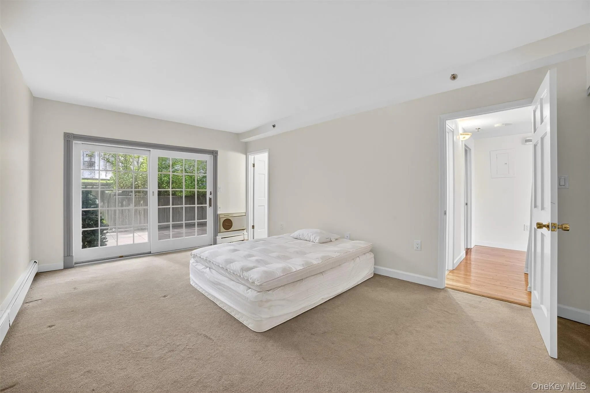 Master Bedroom bedroom featuring a baseboard radiator and access to outside Master Bedroom bedroom featuring a baseboard radiator and access to outside