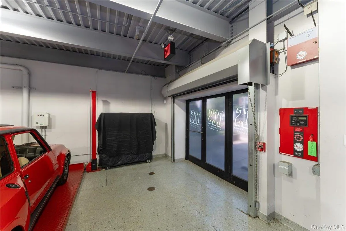 Garage featuring baseboards Garage featuring baseboards