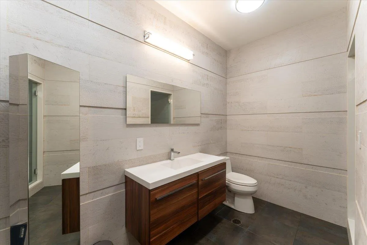 Bathroom featuring vanity and tile patterned flooring Bathroom featuring vanity and tile patterned flooring