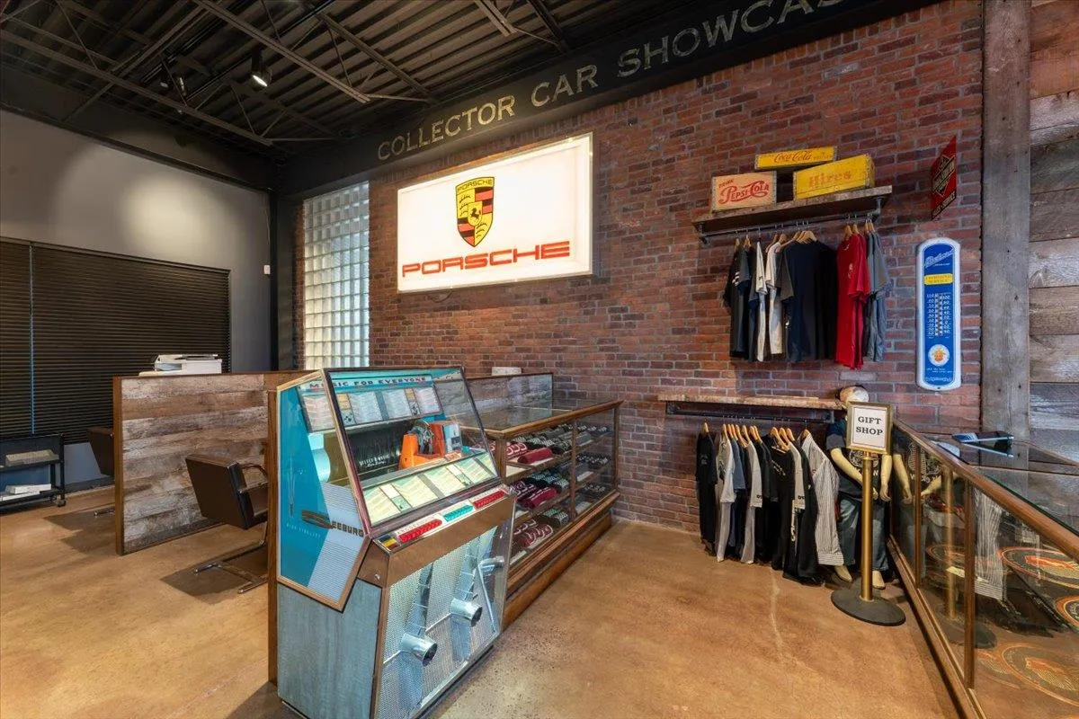 Misc room with finished concrete floors and brick wall Misc room with finished concrete floors and brick wall