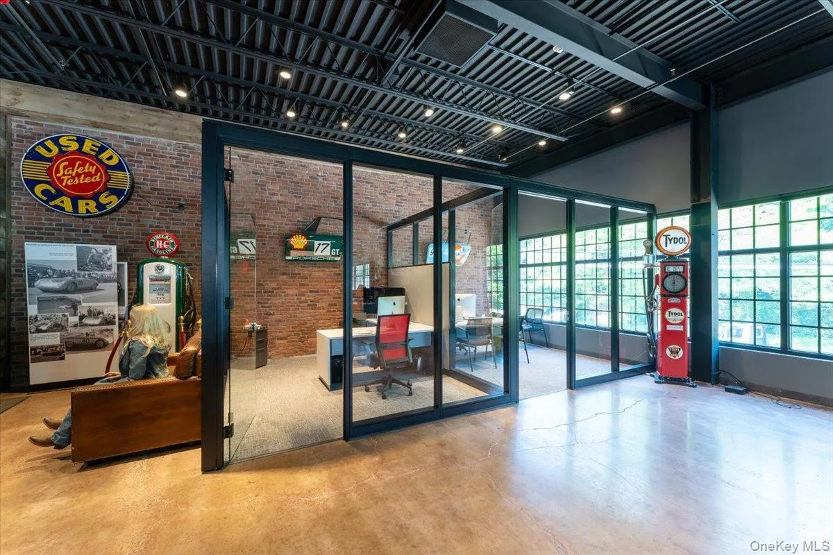 Lobby featuring brick wall and a towering ceiling Lobby featuring brick wall and a towering ceiling