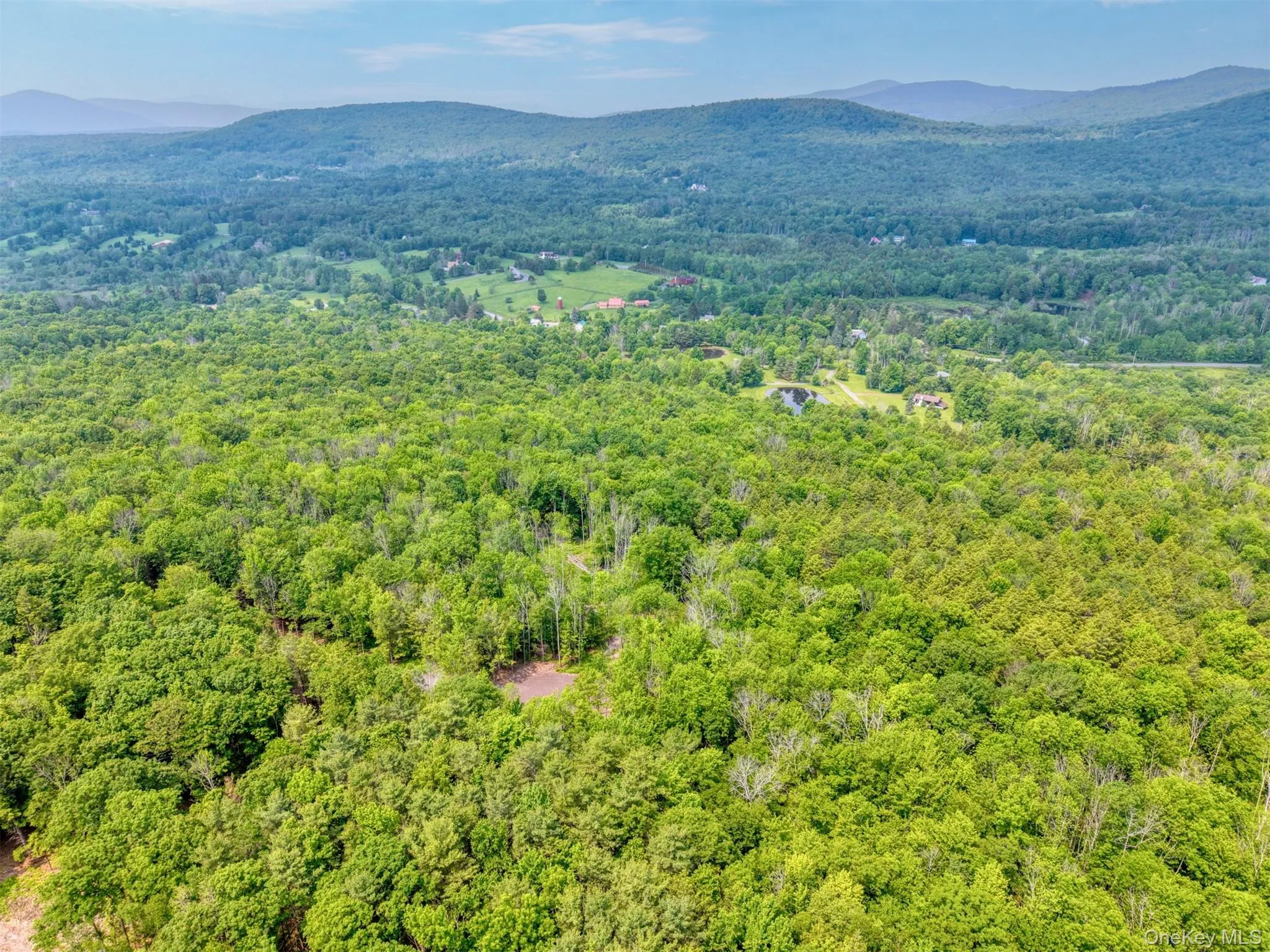Drone / aerial view of a mountain backdrop Drone / aerial view of a mountain backdrop