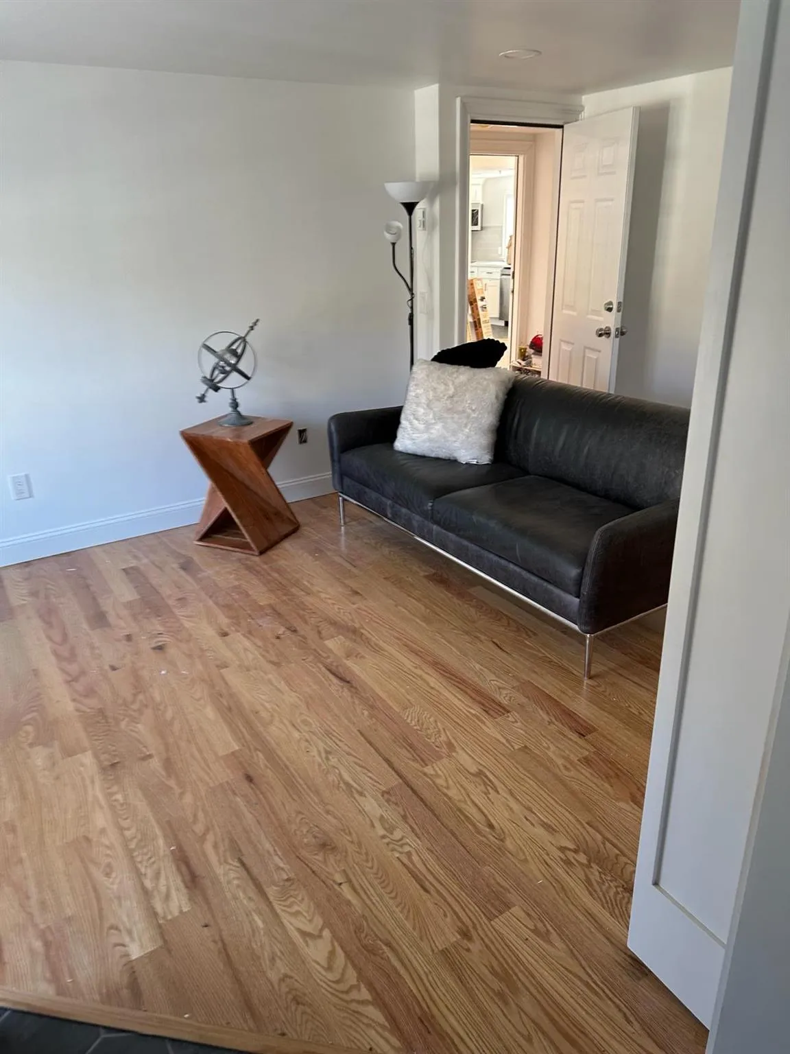 Living area featuring wood finished floors and baseboards Living area featuring wood finished floors and baseboards