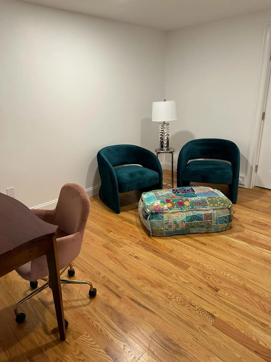 Living area with wood finished floors and baseboards Living area with wood finished floors and baseboards