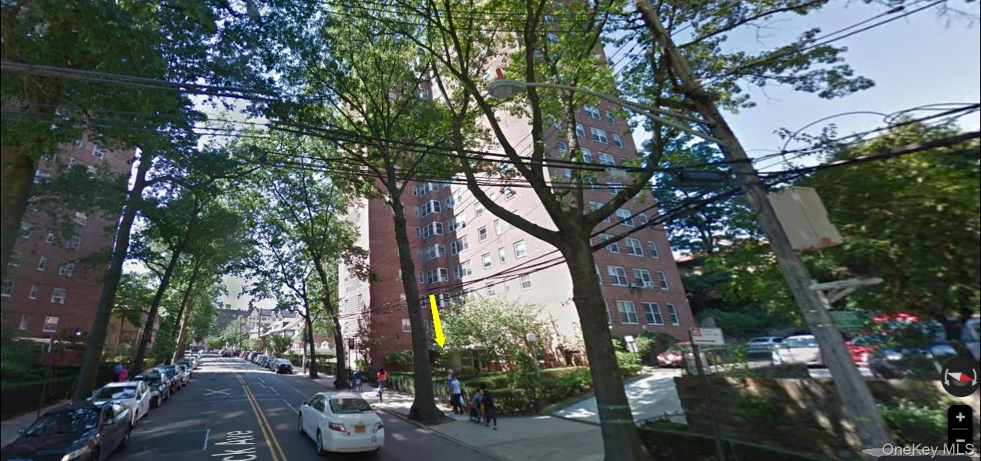 View of asphalt road with sidewalks, street lights, and curbs View of asphalt road with sidewalks, street lights, and curbs