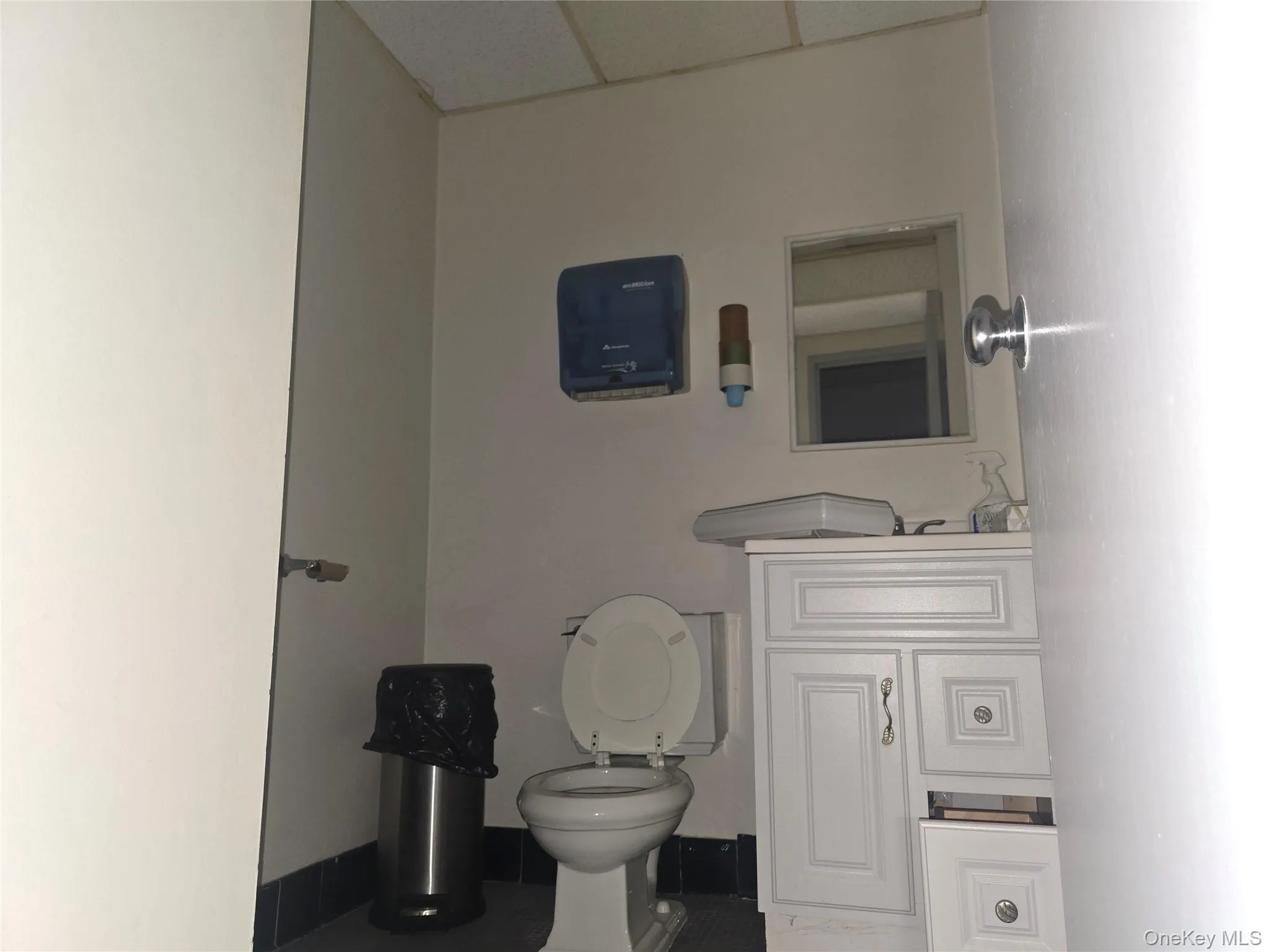 Half bath with toilet and vanity Half bath with toilet and vanity