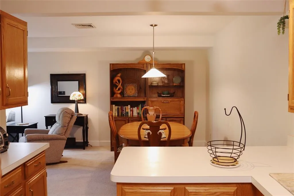 Dining space featuring light carpet Dining space featuring light carpet