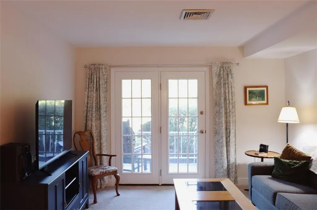 Entryway featuring light colored carpet Entryway featuring light colored carpet