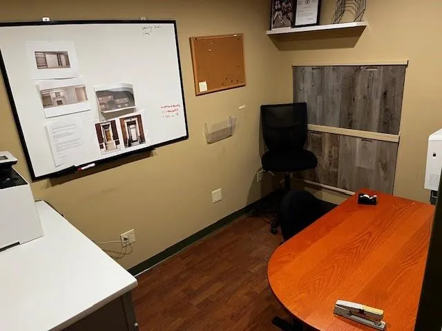 Office area featuring wood finished floors and baseboards Office area featuring wood finished floors and baseboards