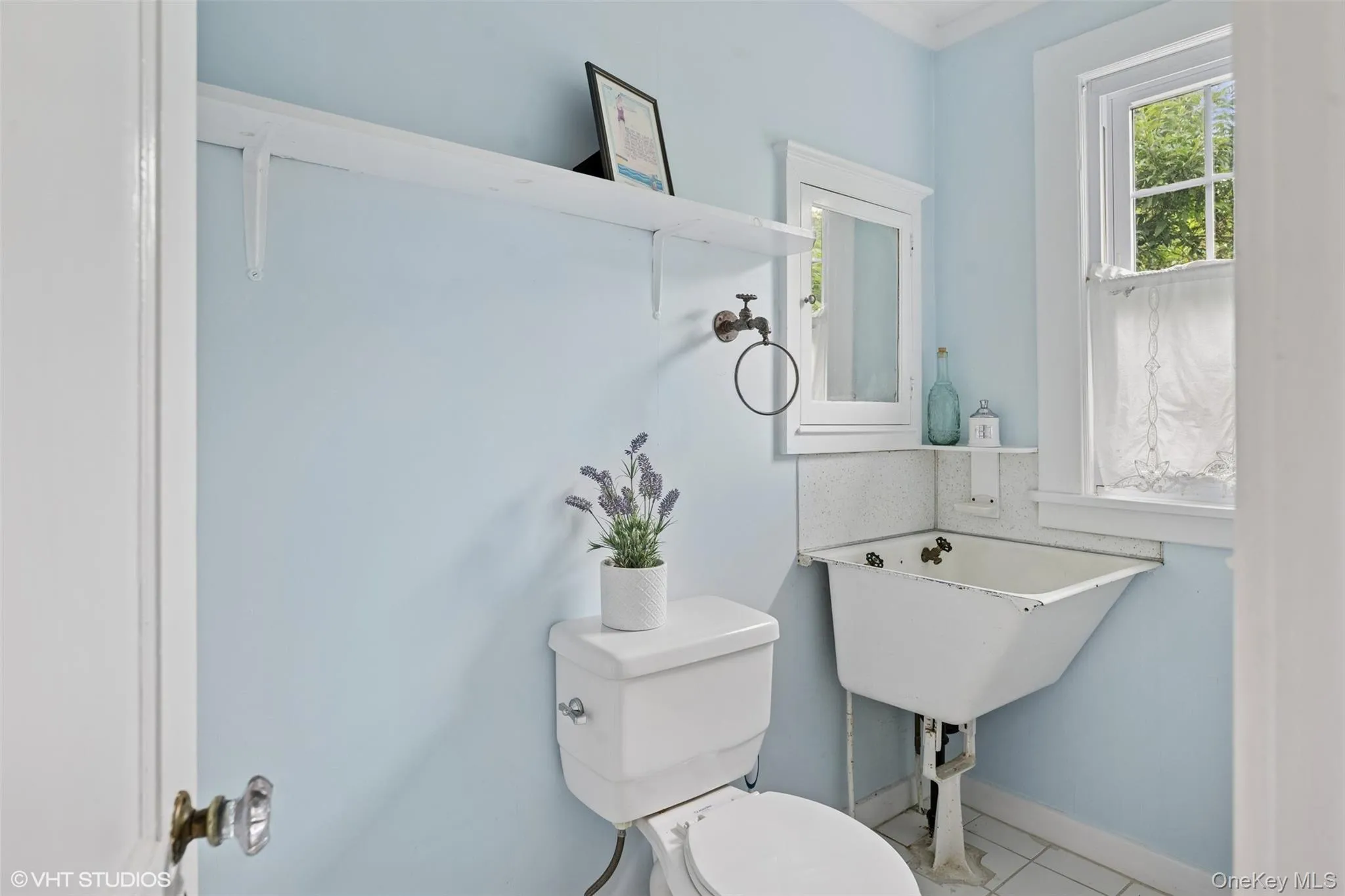 Bathroom with toilet and baseboards Bathroom with toilet and baseboards