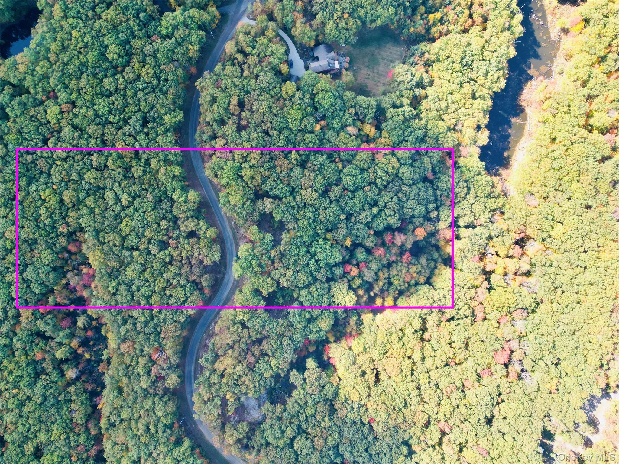 Aerial overview of property's location with property boundaries highlighted Aerial overview of property's location with property boundaries highlighted